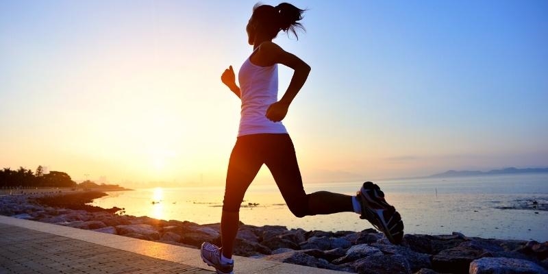 Woman running by the sea
