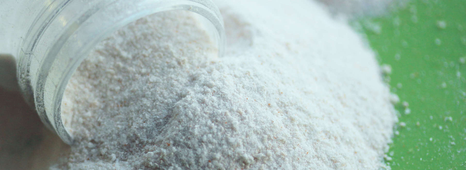 Cambridge Commodities branded vegan collagen formation powder being poured out of tub 